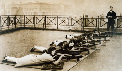 Women learning to shoot by English Photographer
