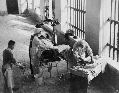 A Field Surgery Unit operating in an Italian prison under fire during World War Two, from a collection of 650 photographs compiled by the Command Association by English School