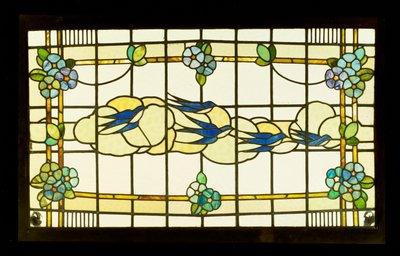 Arts and Crafts panel of a group of swallows before clouds in a border of stylised flowerheads by English School