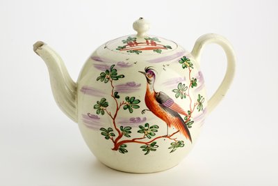 Staffordshire teapot decorated with exotic bird and building among trees, c.1765-75 by English School