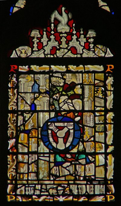 The east window depicting fragments and a Trinity shield by English School