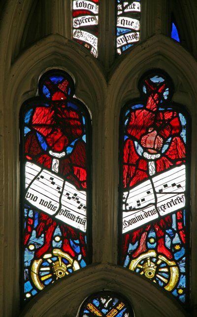 Window depicting angels on wheels with antiphons by English School