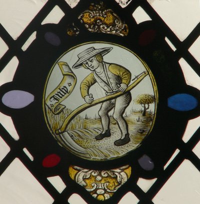 Window depicting the Labours of the Months: July by English School
