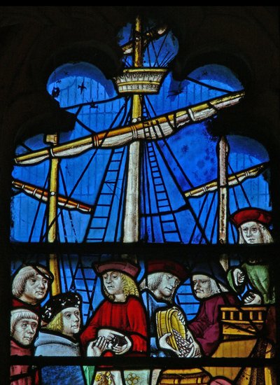 Window depicting a scene from a legend of St Nicholas: the grain ships unload at Myra by English School