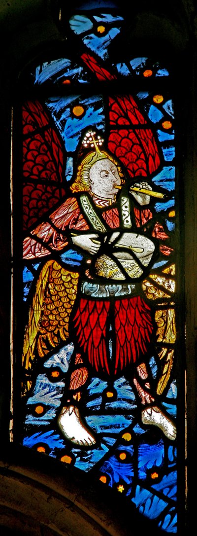 Window depicting a musician angel with pipe and tabor by English School