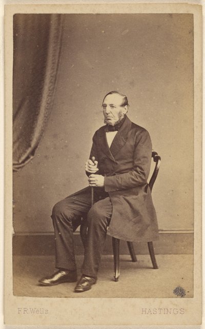 Unidentified elderly man with beard sans moustache, seated by F.R. Wells