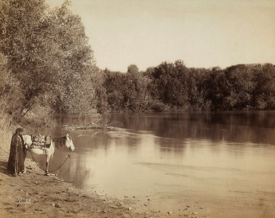 A Man in Traditional Dress with His Horse, in Front of a Lake in Egypt by Félix Bonfils