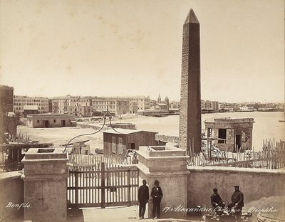Alexandria, Egypt: the Obelisk of Cleopatra, with four men posing for the photograph by Félix Bonfils