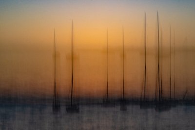 Blurred Sunset Sailboats by Franco Tessarolo