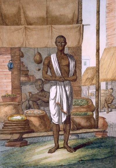 Grocer outside his shop with wares in sacks, from 