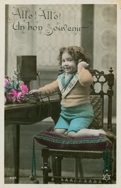 Child using telephone by French Photographer