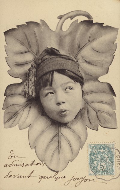 Face of a little boy at the centre of a leaf by French Photographer