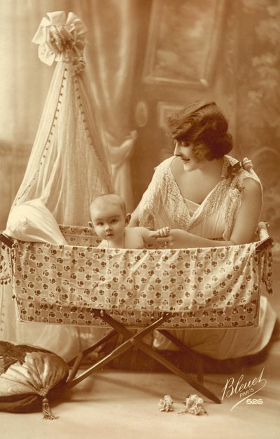 Woman with a baby in a cradle by French Photographer