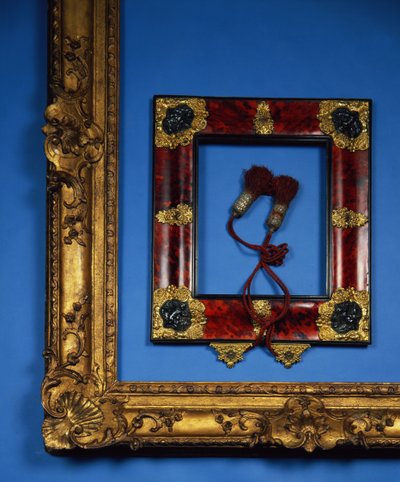 Regency reverse profile frame with ormolu and embossed silver mounts to the corners and centres with the original tassels (tortoiseshell) by French School