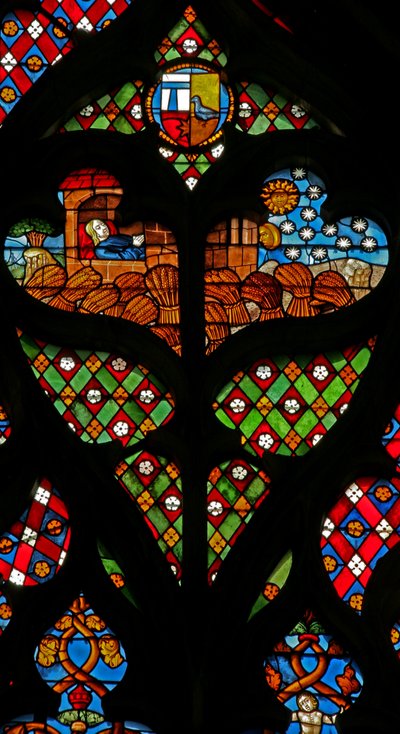 Tracery light with Joseph dreaming of the sun, moon and stars, and that his brothers