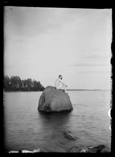Hugo Simberg Sitting on a Rock, Essaari and Suonionsaari in the Background by Hugo Simberg