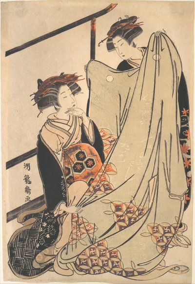 Two Beauties Looking at Kimono by Isoda Koryusai