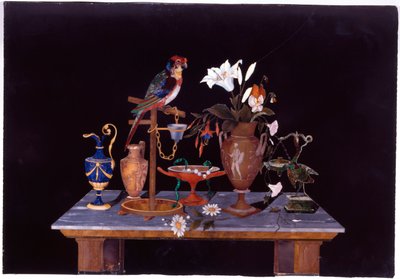 A Florentine pietra dura plaque with a parrot on its perch on a table with an Etruscan krater vase, a vase of flowers and ewers by Italian School
