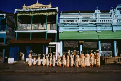 Buddhist Nuns of Various Ages Parade on the Sidewalk Soliciting Alms, Maymyo, Burma by James L Stanfield