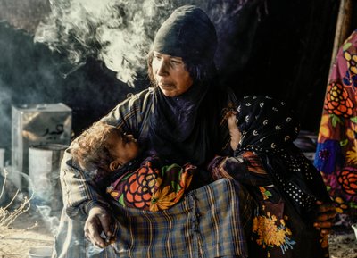 Syrian Bedouin Woman with Her Small Children in a Tent by James L Stanfield