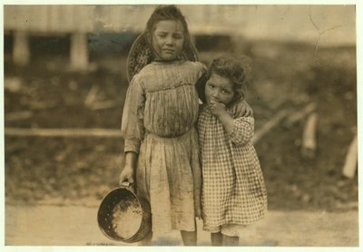 Maud and Grade Daly, 5 and 3 years old pick about a pot of shrimp each day for the Peerless Oyster Company, Bay St. Louis, Mississippi, 1911 by Lewis Wickes Hine