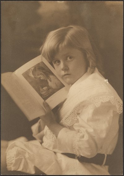 Portrait of Child Holding Book Open to Illustration by Louis Fleckenstein