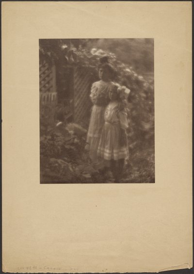 Two Young Girls Standing in a Garden by Louis Fleckenstein