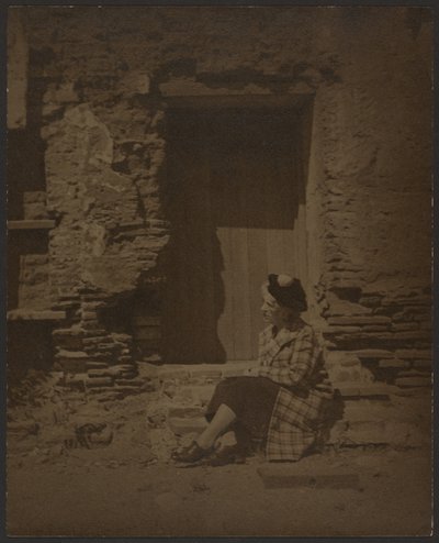 Woman Seated Before Deteriorating Building by Louis Fleckenstein