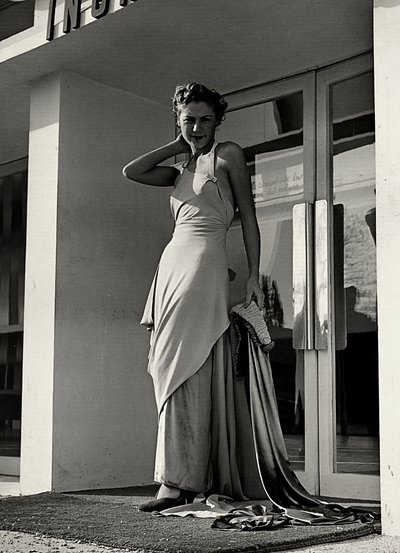 Model in evening dress created by the couture house "Graldi" by Luis Bogino