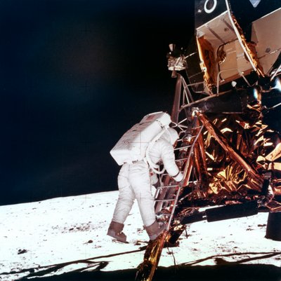 Edwin Buzz Aldrin descends the steps of the Lunar Module ladder to walk on the Moon by NASA Images