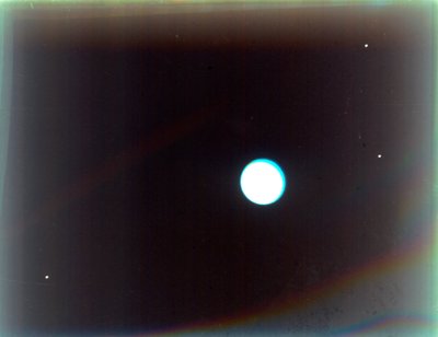 Uranus with satellites Miranda, Ariel and Umbriel, from Voyager 2, 24 January 1986 by NASA Images