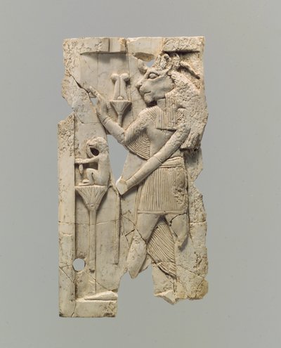 Furniture plaque carved in relief with lion-headed figure by Neo Assyrian