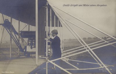 American aviator Orville Wright inspecting the engine of his aeroplane by Photographer German