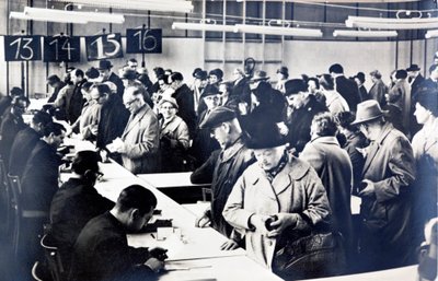 East German citizens queuing to obtain permits to visit relatives in the West by Photographer German
