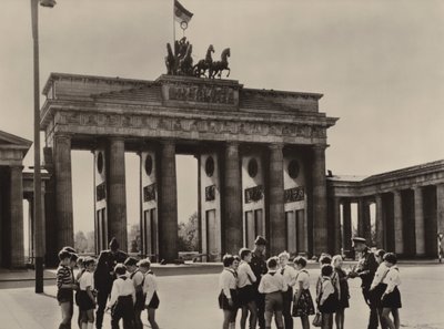 Young pioneers come to the Brandenburg Gate, the landmark of Berlin, to see their friends, the frontier guards by Photographer German