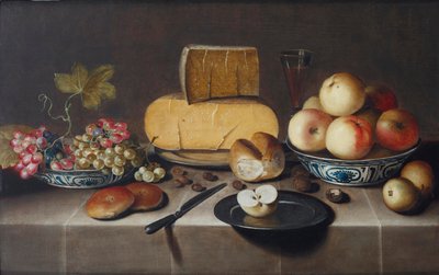 Cheese on a Silver Plate, Red and White Grapes and Apples in Porcelain Wanli Bowls, Bread Rolls, a Knife and a Sliced Apple on a Plate, All on a Draped Table by Roloef Koets