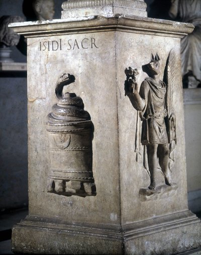 Altar dedicated to Isis. Left: mystic stone with snake and right: Anubis-Hermès. The words 