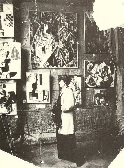Alexandra Ekster in Front of Udaltsova’s Paintings at the Exhibition The Store, Moscow by Russian Photographer