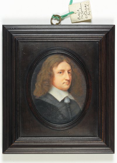 A gentleman in a dark grey coat, referred to as 