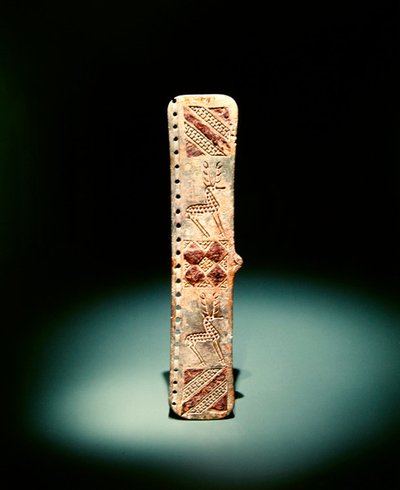 Belt clasp engraved with carved geometric ornament and stags by Scythian Scythian