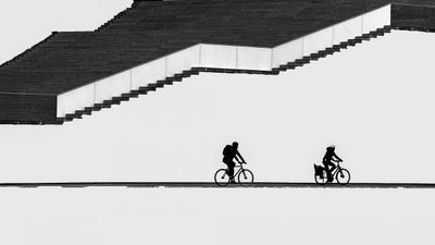 Silhouetted Cyclists Stairs by Shanrui Ren