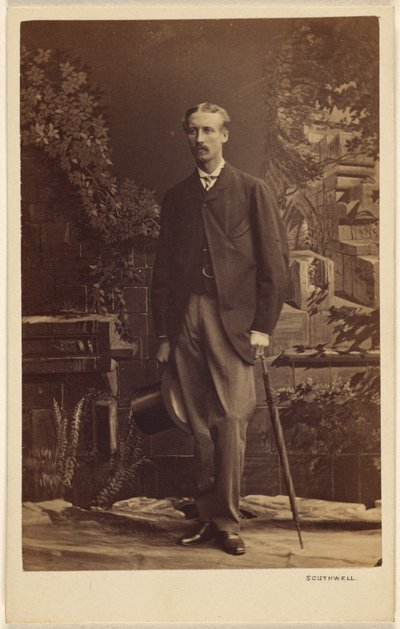 Unidentified Man with Moustache, Holding a Top Hat and Umbrella, Standing by Southwell Brothers