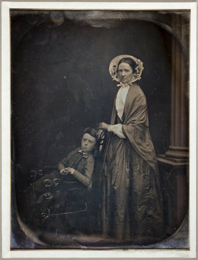 Untitled (A Woman in Bonnet and Shawl, with her Seated Son) by Southworth and Hawes