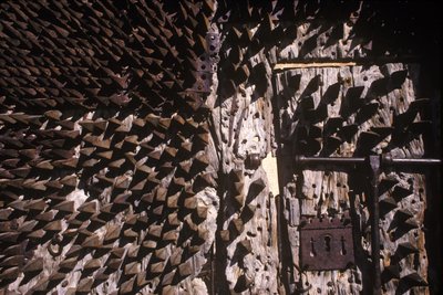Metal spikes embedded in a castle door by Spanish School