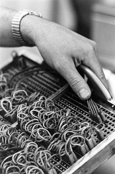 Computer operator Don Murray working with IBM early digital computer that uses punch cards by Ted Spiegel