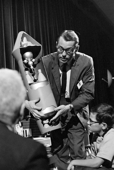 NASA engineer explains and displays internal mechanism of a rocket at Seattle World