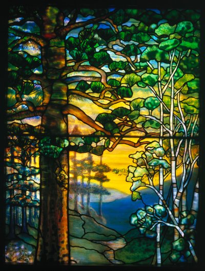 A landscape window depicting a meandering stream shaded by towering fir trees by Tiffany and Company