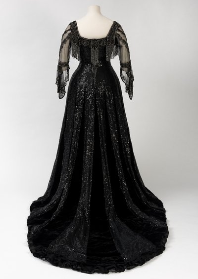 Black Full Length Evening Gown Worn by Queen Alexandra, with Bead and Sequin Decoration and Incorporating Queen Alexandra’s Signature Black Silk and Gold Lettered Name Tape, Made by Barolet of Knightsbridge, London 1908-1910 by Unbekannt