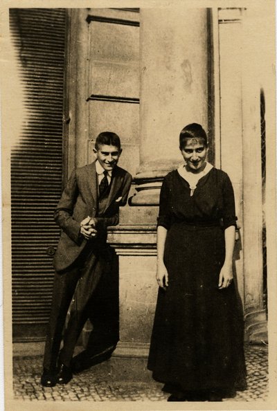 Franz Kafka with his sister Ottla before Oppelt House in Prague by Unbekannt
