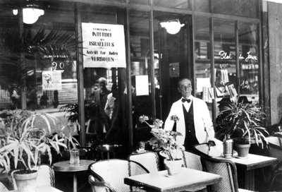 Notice in a restaurant window banning Jews from entering, German-occupied Paris, July 1940 by Unbekannt